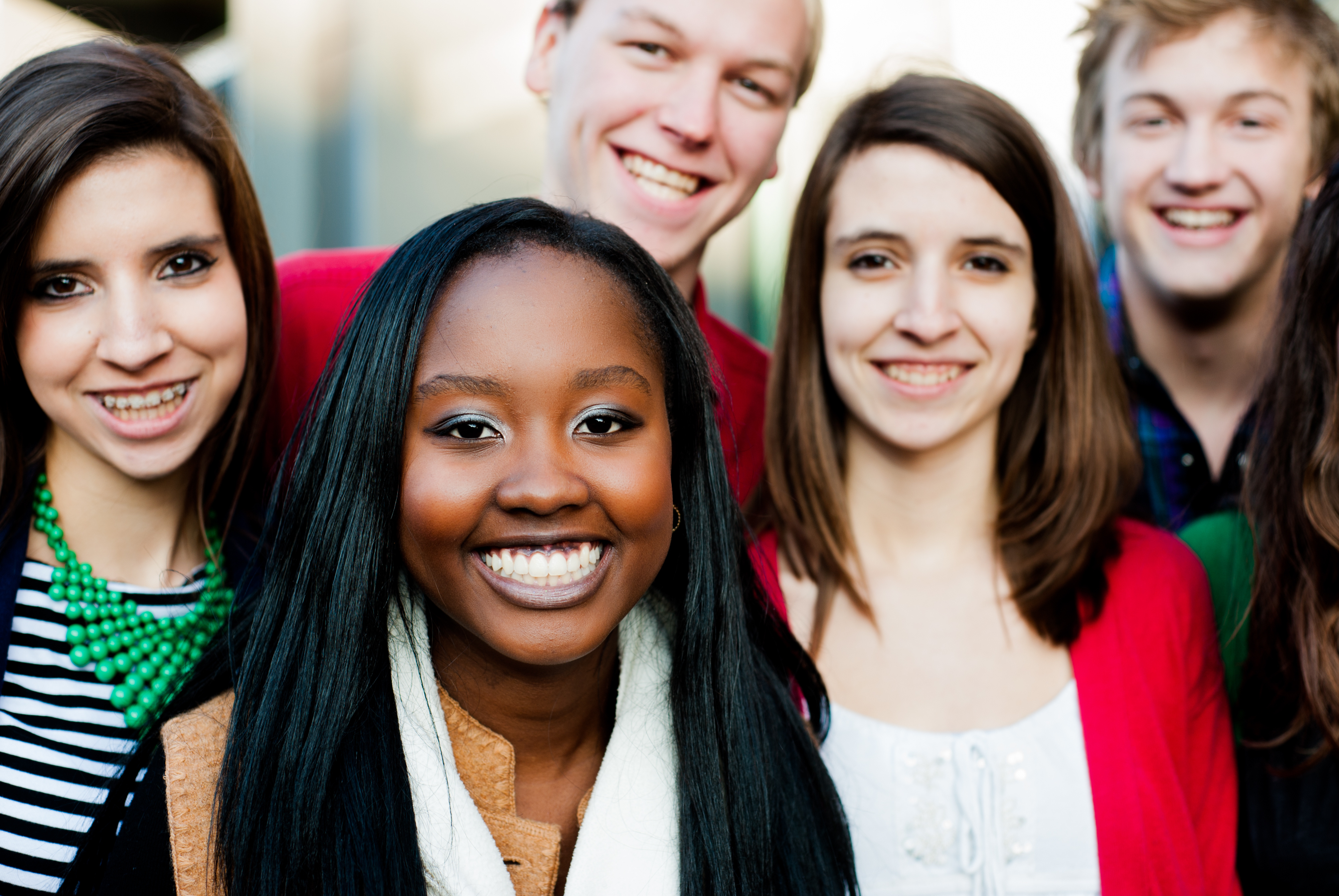 A group of teens huddled together