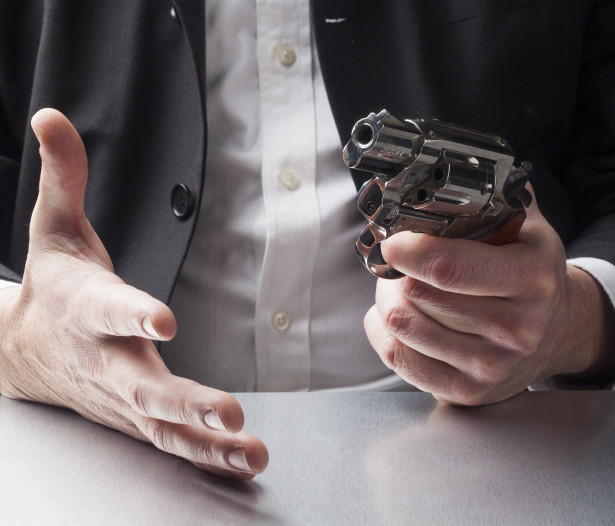 man holding gun - close up